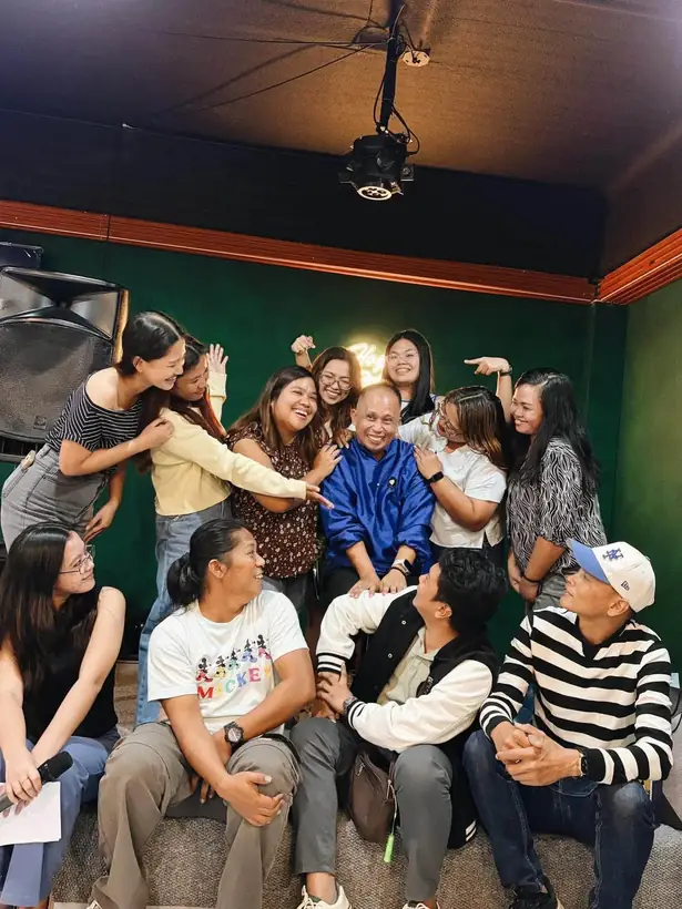 Friends sharing a joyful moment at Harong ni Kadunong